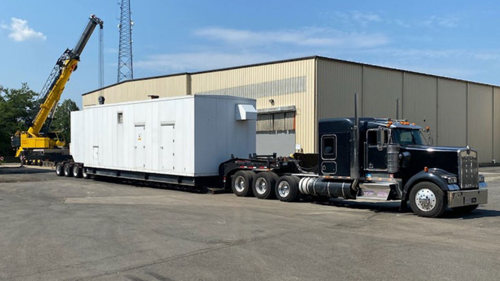 large industrial generator being shipped to rental location